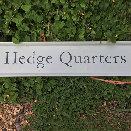 Tea rooms hedge quarters sign